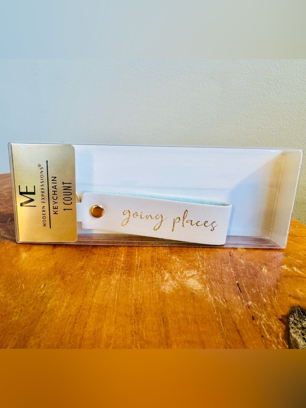 NWT “Going Places” Key Chain in White Leather With Gold Font
